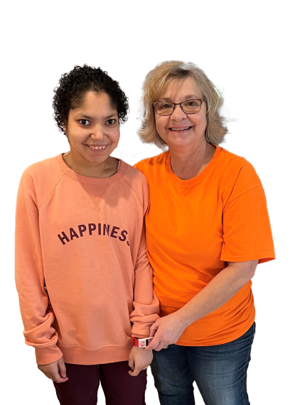 two women wearing orange